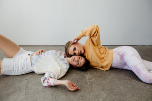 Two women lying on the floor
